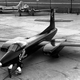 The XP-87 (later XF-87), likely photographed at the Curtiss factory in St. Louis. The size of Blackhawk is evident when compared to the two men examining the front wheel. A B-17 and DC-3 are visible in the background. (US Air Force)